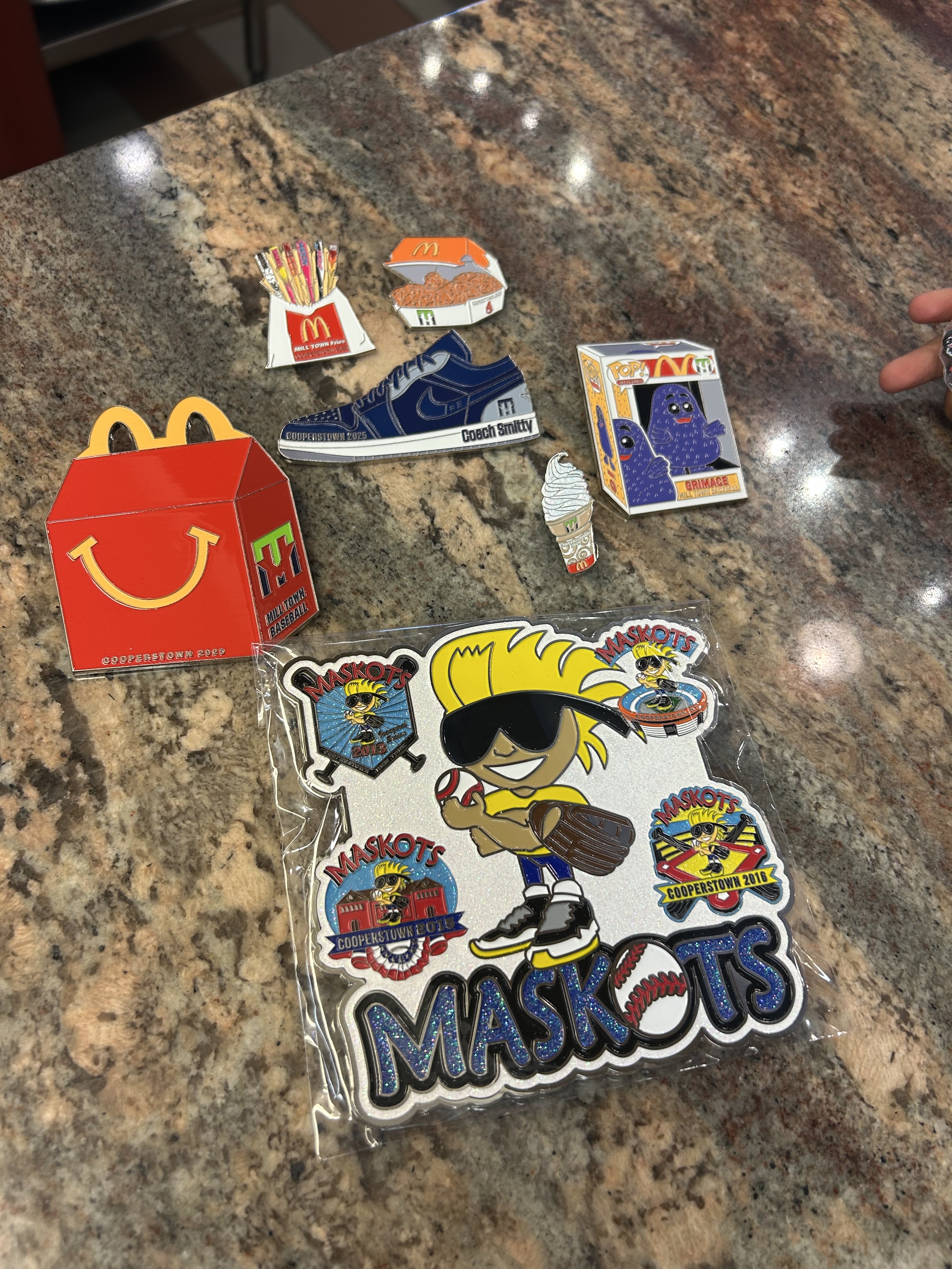 Maskots pins and McDonald's themed team pins