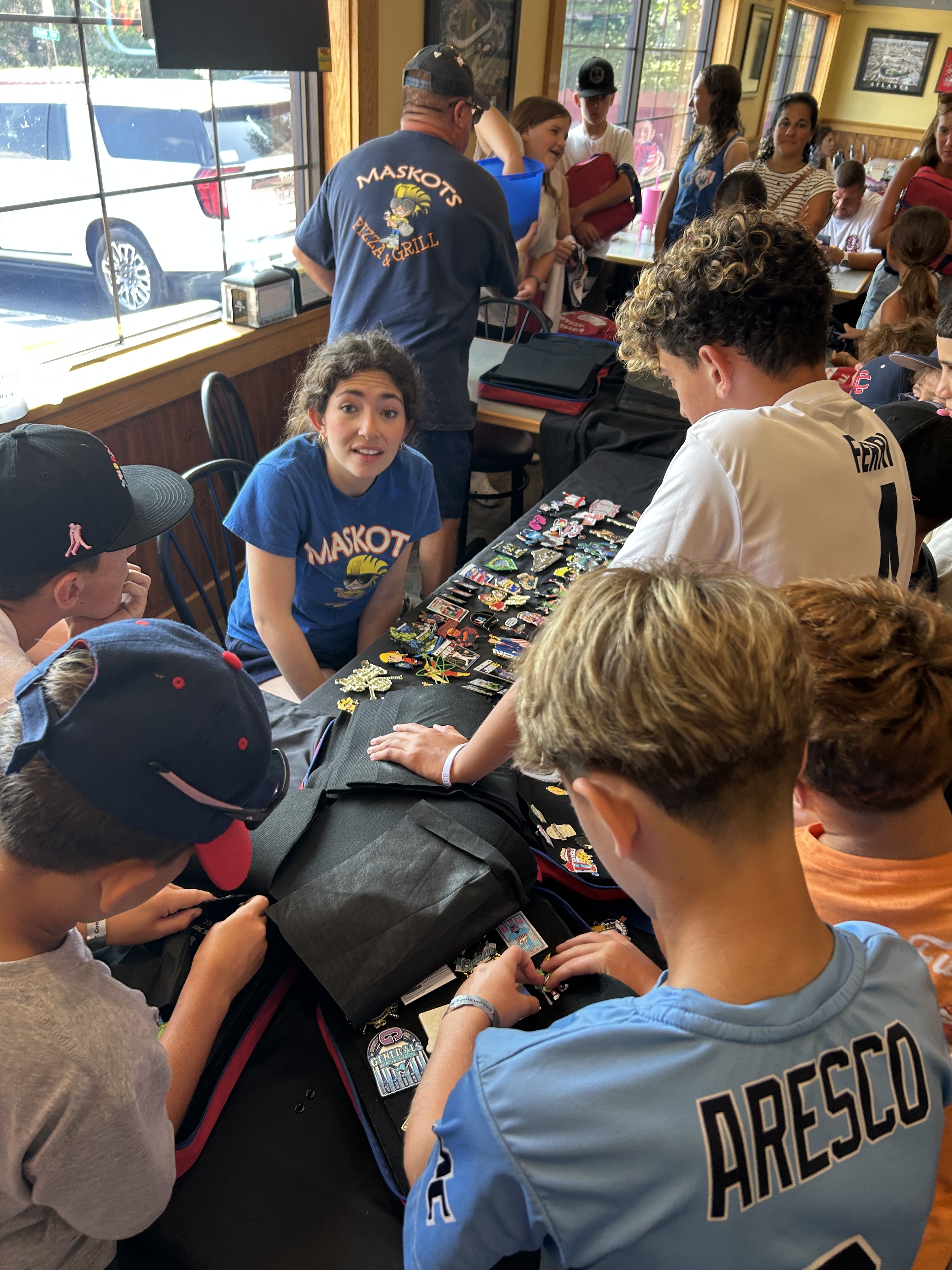 Boys examining trading pins